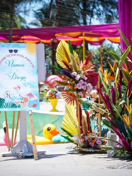 A personalized welcome sign for a pool party. The cute illustrations and tropical theme set a fun and relaxed tone for the event right from the entrance.