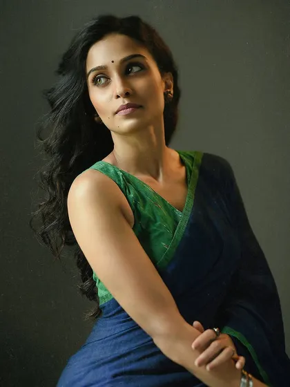 Capturing a candid, in-between moment can result in a beautiful portrait. Here, the model is looking off-camera as if lost in thought, which gives the image a natural and authentic feel.