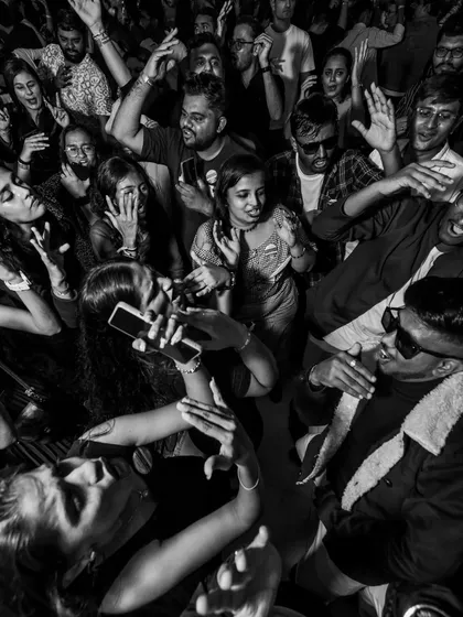An overhead view of a packed dance floor, completely lost in the music. This is the goal for every event: to create a space where everyone feels free to dance and celebrate together.