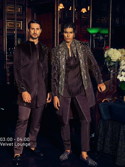 The Velvet Lounge is about owning the spotlight. Here, two men in deep wine velvet ensembles, one with heavy silver embroidery, showcase elegance, unfiltered.
