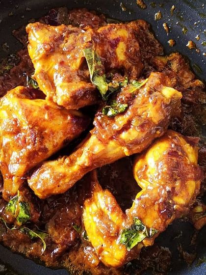 Murgir Ghee Roast, a sweet, sour, and spicy chicken dish. The aroma of ghee and roasted spices makes this an incredibly indulgent and memorable dish for any party.