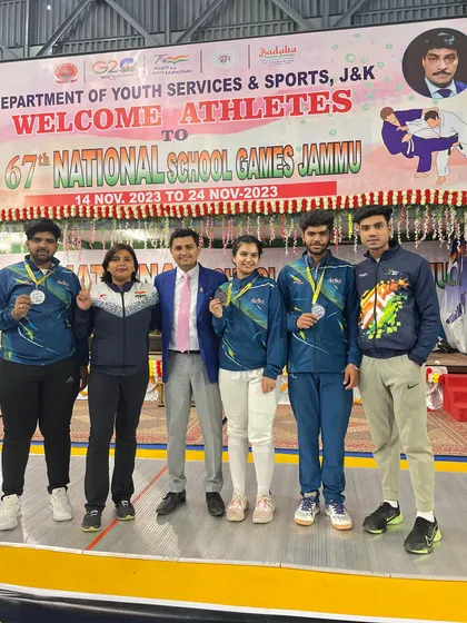 The full team of medal winners from the National School Games in Jammu, pictured with their coaches and officials.