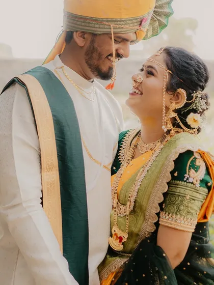A beautiful, candid moment of the couple looking at each other with pure happiness. This image perfectly captures the love and laughter they share.