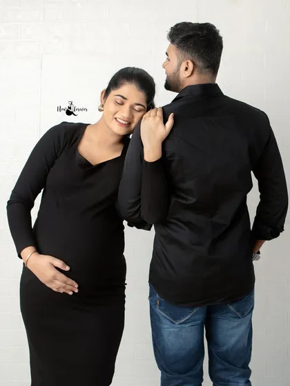 She rests her head on his shoulder, a picture of peace and trust. These casual studio portraits are all about capturing genuine emotion and connection.