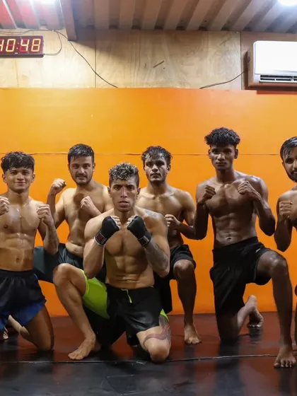 The fight team, focused and ready. The clock in the background is a reminder that every second counts, in training and in the cage. We are prepared.