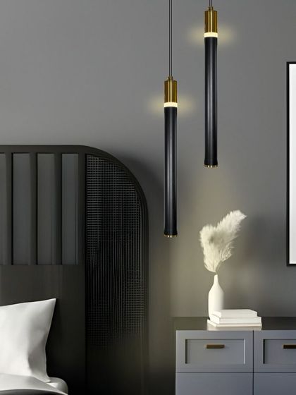 A pair of these black and gold pendants hung over a dresser or console table creates a stylish and functional vanity area.