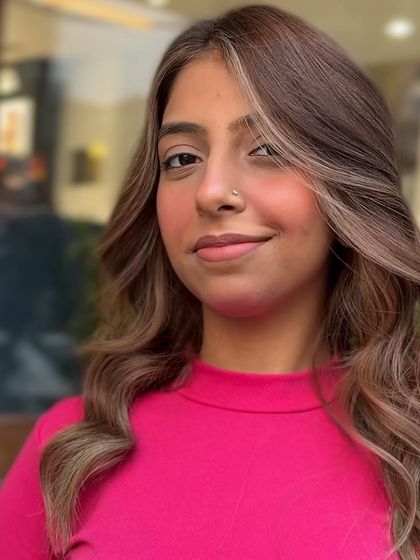 A final look at this beautiful blonde transformation. The client's smile says it all; she loves her new radiant and stylish hair.