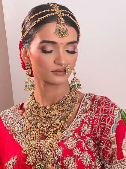 A close-up of the bride's flawless makeup and the elegant simplicity of her bridal bun.