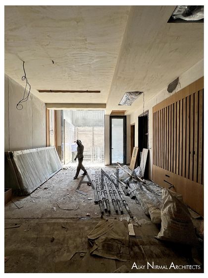 An interior view during the construction of the DLF Phase 1 residence. This shows the raw volumes and the beginning of interior paneling, illustrating the transformation from a structural shell to a finished home.