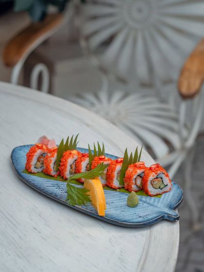 The Kyoto Ember Uramaki, a fusion of freshness and fire with tender tuna, buttery avocado, and a crown of spicy tobiko.
