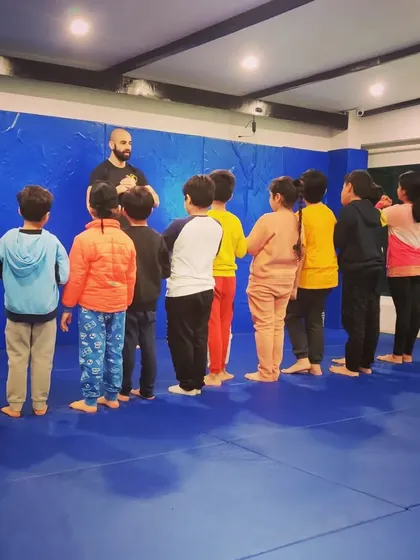 Lining up and listening. Respect and discipline are core to what we do, and it starts from the moment they step on the mat. This is a key part of their martial arts journey.