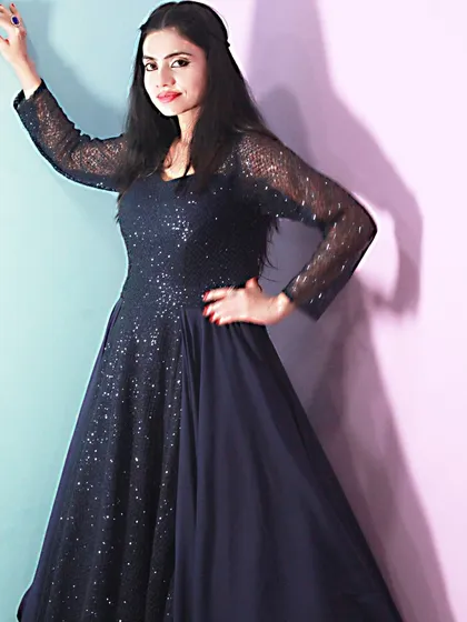 This navy blue sequined gown is pure elegance. It's a perfect rental for a cocktail night, reception, or any formal evening event.