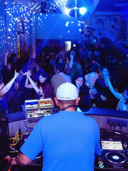 A view from my perspective, looking out at a packed and energetic dance floor.