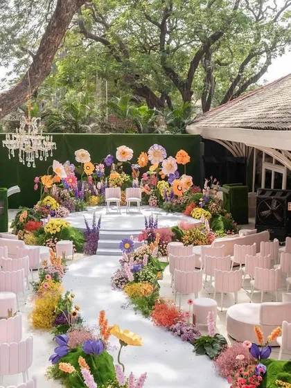 A celebration of love should be as vibrant and joyful as the couple themselves. I designed this "Bloom" wedding with a kaleidoscope of oversized flowers and playful colors to create a whimsical, immersive garden that felt straight out of a fairytale.