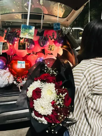 A car trunk or 'dikki' surprise is a unique and fun way to celebrate. I fill the car boot with balloons, flowers, photos, and a "Happy Birthday" banner to create a memorable moment they will never forget.