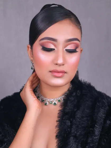 Hello Gorgeous. This glam party look, created by one of our students, features a soft pink smokey eye, sharp liner, and a radiant highlight.