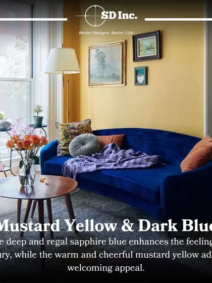 An example of using bold color combinations. A royal blue velvet sofa pops against a warm mustard yellow wall, creating a look that is both luxurious and welcoming.