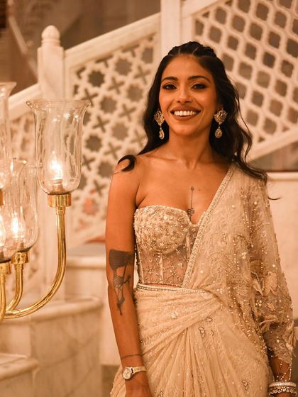 A joyful, candid shot of Anasuya Sengupta at an event. Her smile is infectious, and it’s a moment of pure happiness.