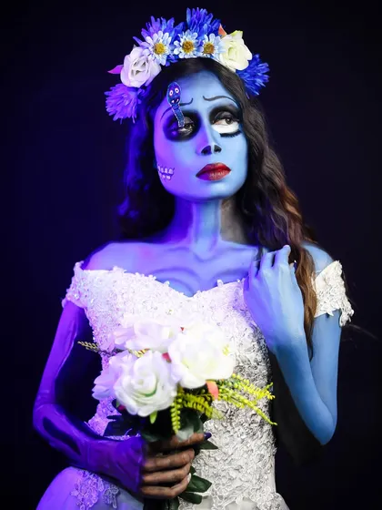 A stunning recreation of the "Corpse Bride." This look required skills in body painting, creating sunken facial features with contouring, and expressive character makeup.