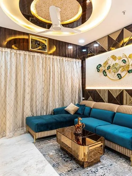 Another angle of the stunning Lodha Belair living room, highlighting the intricate geometric patterns on the wall and the custom-fluted sofa design. The gold coffee table adds a touch of opulence to the space.