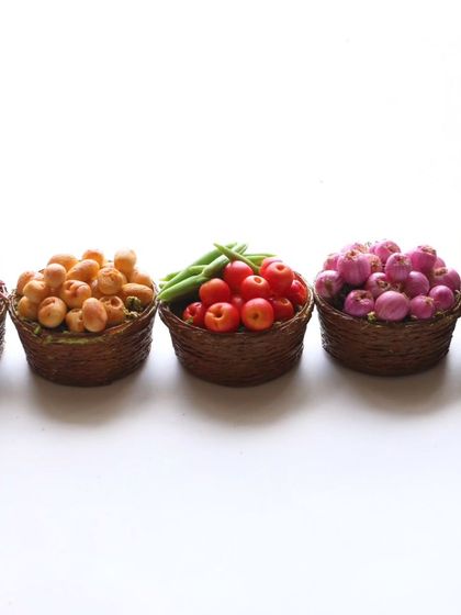 A row of my miniature vegetable baskets, perfect for a dollhouse market.