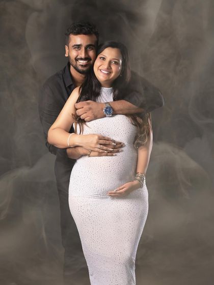 A joyful portrait of the couple embracing, with the smoky background adding a unique, ethereal quality.