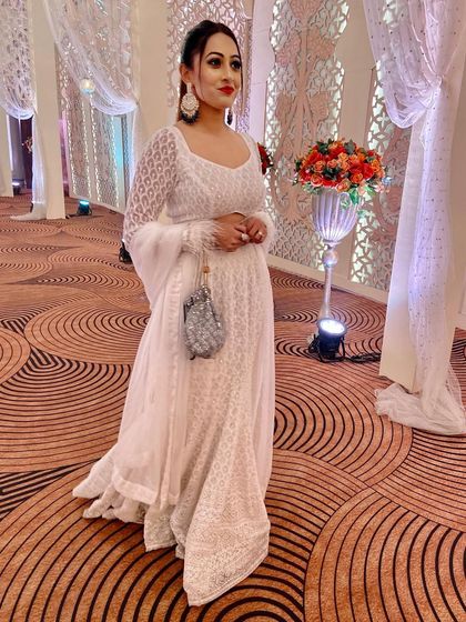 Another shot of my white Chikankari look, complemented by a bold red lip. It's a classic combination that never goes out of style.
