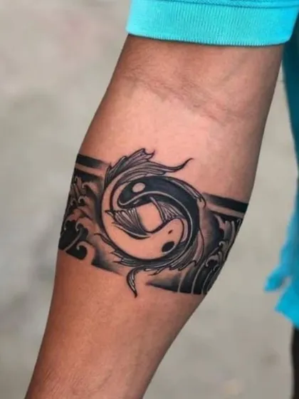 A design concept for a Yin Yang armband tattoo, featuring two koi fish swimming in a circle. This symbolizes balance, harmony, and the duality of life.