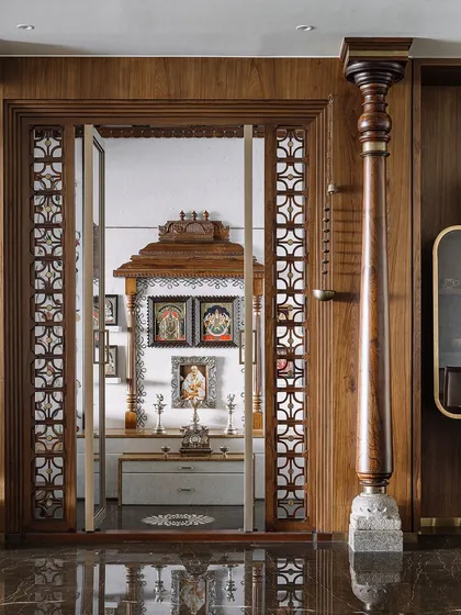 I believe a pooja room should be a sanctuary of peace. For this space, I drew inspiration from the grandeur of South Indian temples, using vintage pillars, custom jalli work, and a mantapa that echoes temple gopurams. It’s a celebration of tradition, crafted with intricate details to create a truly sacred heart for the home.