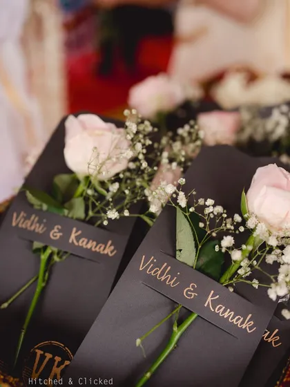 Elegant welcome notes attached to single roses for each guest. This simple, beautiful gesture sets a tone of romance and appreciation.