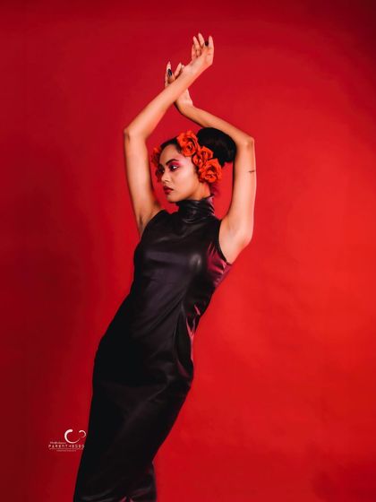 A beautiful and strong pose with arms crossed above the head. The symmetry and power in this shot are captivating.