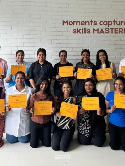 A group photo of smiling workshop graduates, showcasing the positive and successful learning environment.