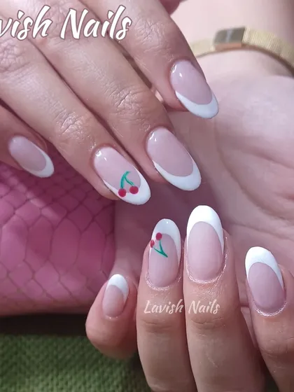 A shorter version of the cherry French manicure, showing the design on elegant, natural-length nails.