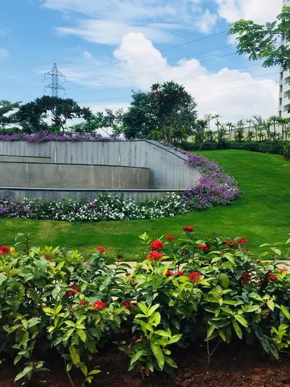 This image highlights our use of tiered retaining walls and sloped lawns to create visual interest and manage elevation changes in a large community space.