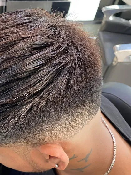A close-up shot of the texture and blend in a taper fade. You can see how each hair is cut to contribute to the smooth gradient.