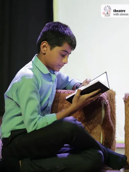 A quiet, studious moment on stage during our Narnia production, showing the depth of character our young actors can achieve.