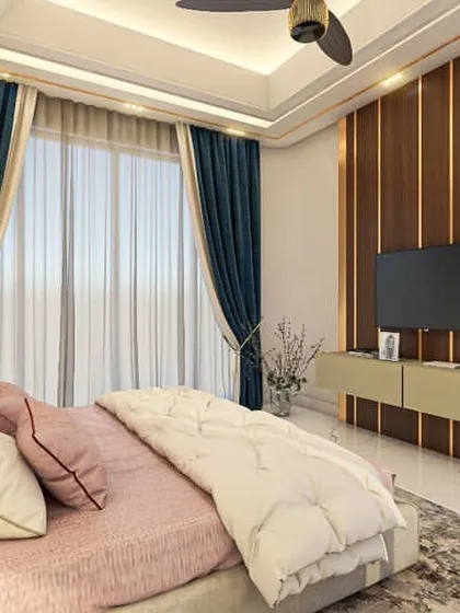 A view of the TV and media unit in the pink bedroom. The design maintains a clean and modern aesthetic, with a wood-paneled feature wall and a minimalist console.