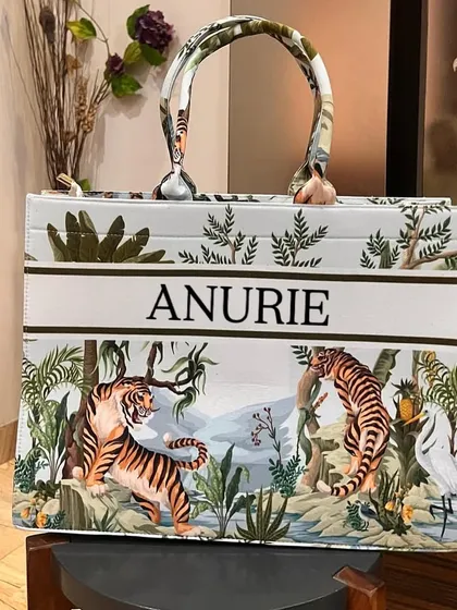 Make a statement with our personalised suede velvet tote bag. This one features a bold tiger print and a custom name, making it a stylish and roomy companion for travel, shopping, or everyday use.