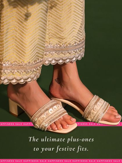 These are the ultimate plus-ones to your festive fits. The wide strap is adorned with sequins and beads, offering a secure fit and a touch of glamour on a comfortable block heel.