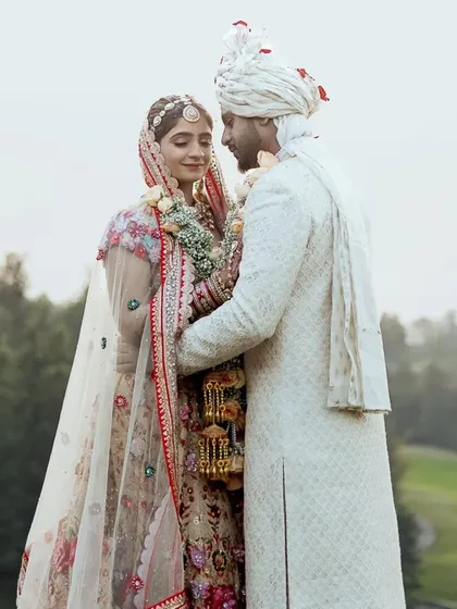 In a place where dreams come true, two people found their forever. This isn't just a portrait; it's the story of a love that feels like home, captured against the stunning backdrop of the Oxford Golf Resort in Pune.