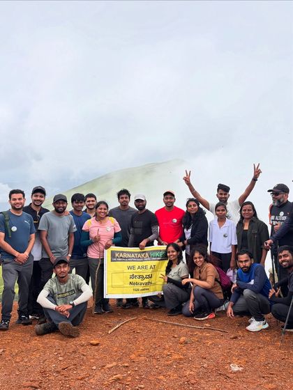 Our group proudly holding the Karnataka Hikes banner at the Netravathi summit.