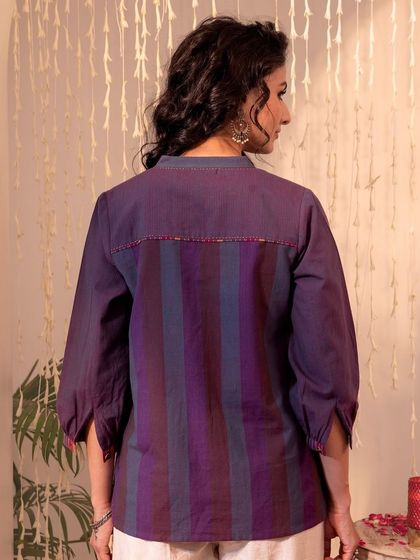 The back of our Haveli Purple Striped Top, showing the simple, clean lines and the beautiful striped fabric. It's a testament to thoughtful, contemporary design.