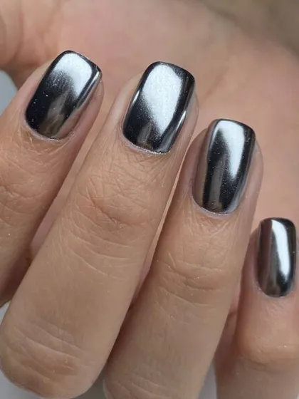 The power of chrome. This look features a high-shine, liquid-metal silver chrome finish on perfectly shaped square nails. It's a futuristic and bold style that is guaranteed to turn heads.