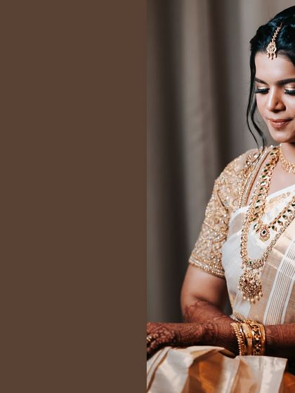 A close-up portrait of the bride, focusing on her elegant jewelry and serene expression. The simple background keeps all the attention on her.