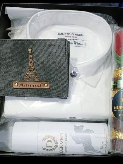 This hamper combines a classic white U.S. Polo Assn. shirt with a personalized wallet, deodorant, and chocolates.