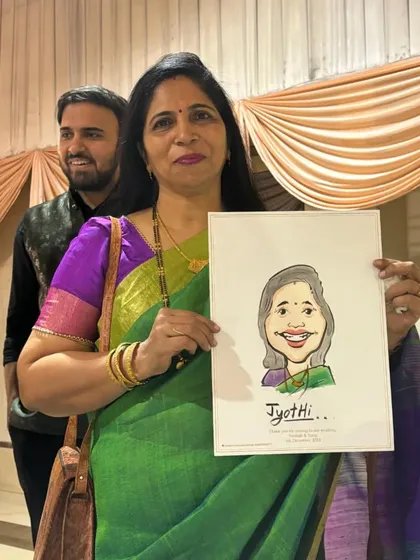 A guest holds her finished caricature, showcasing the simple yet expressive style of my watercolor portraits.