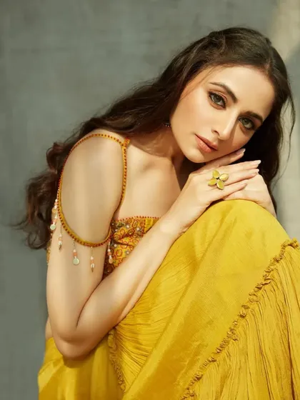 A lovely portrait of Zoya. The half-up, half-down hairstyle is elegant and timeless, making it a perfect choice for any traditional event.