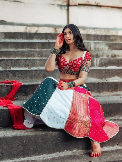 An expressive and emotional portrait. The hand to her face adds a layer of drama and storytelling to this beautiful outdoor shot.