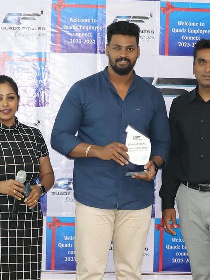 Recognizing Mr. Ramesh from the Seshadripuram Branch with the 'Employee of the Branch' award for his outstanding performance and dedication.