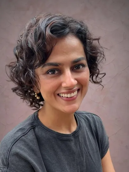 A new cut and color should make you feel amazing. Here is Shraddha looking radiant after I refreshed her curly bob with subtle Pintura highlights to add dimension and life to her natural texture.